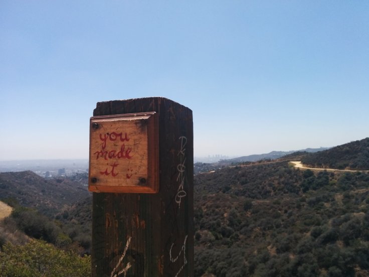 "You made it" written on a post, mid hike. Did I? Really?